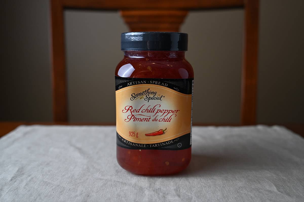 Image of the Costco Something Special Red Chili Pepper Spread  sitting on a table unopened.