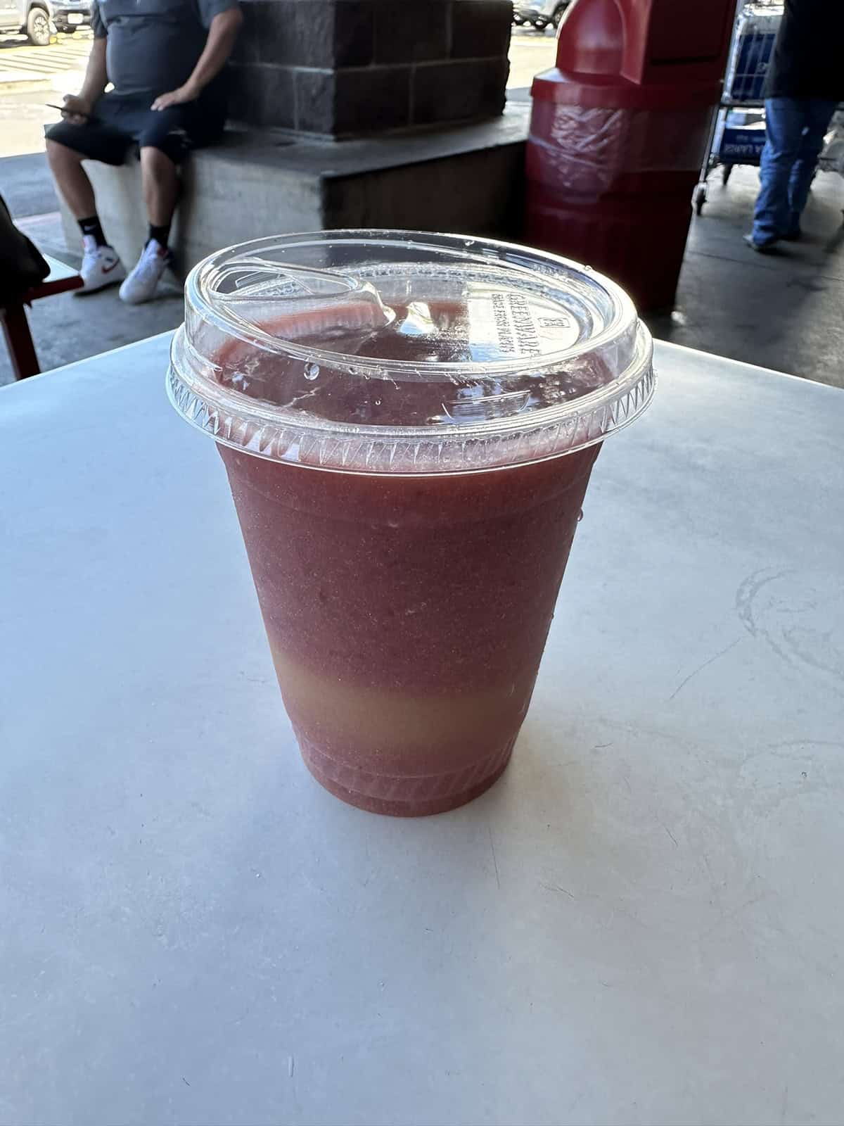 Image of the Costco food court fruit smoothie sitting on a table. 