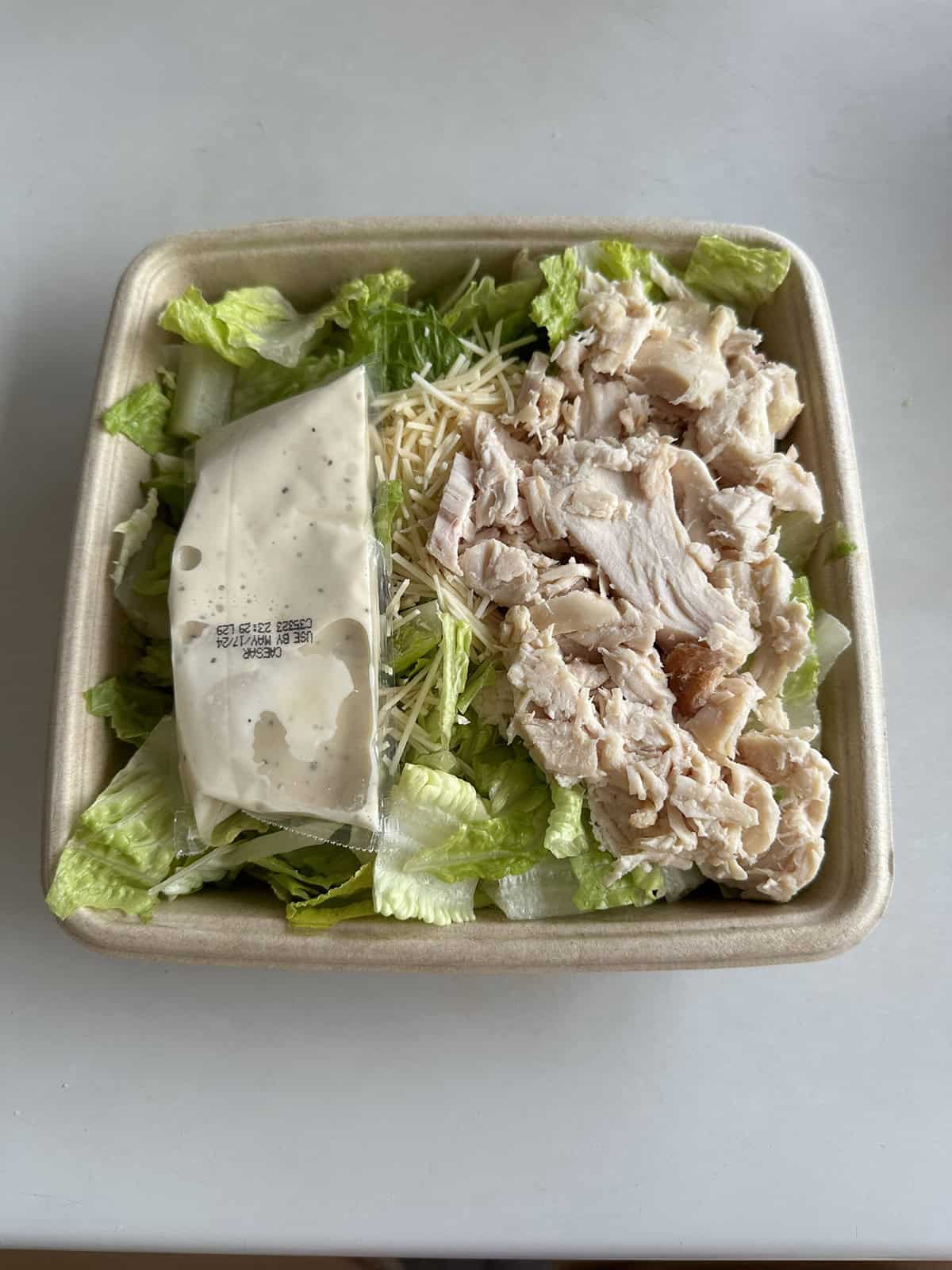 Top down image of the chicken Caesar salad from the Costco food court.