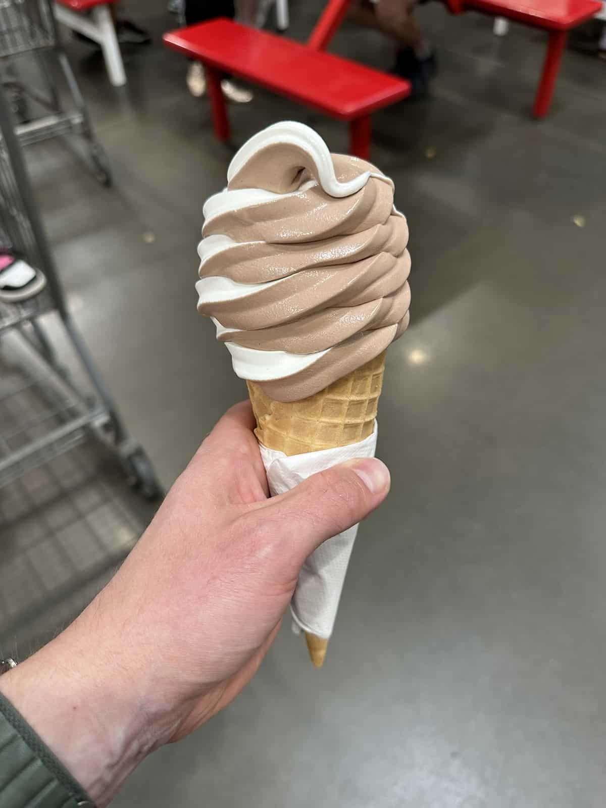 Image of a hand holding a twist cone from the Costco food court.