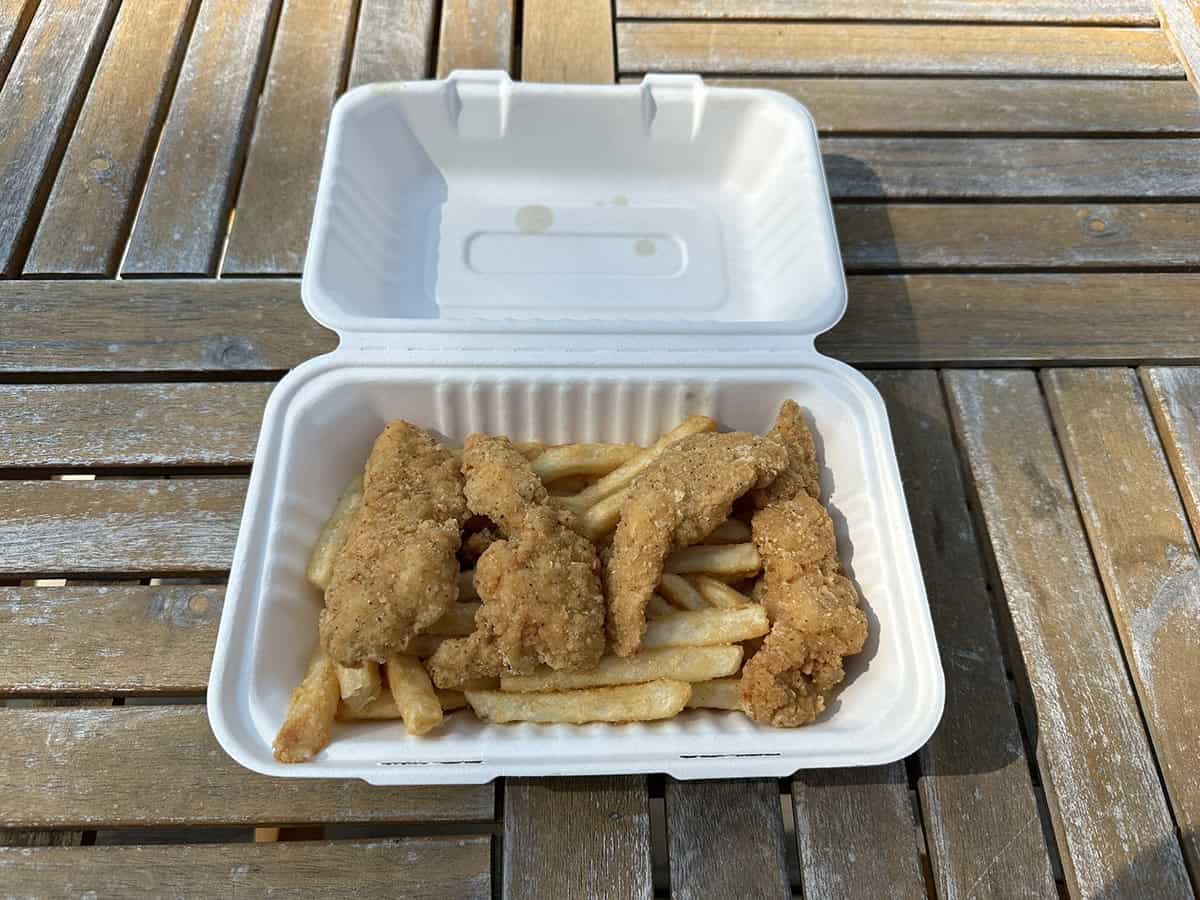 Top down image of a container of chicken strips and fries from the Costco food court.