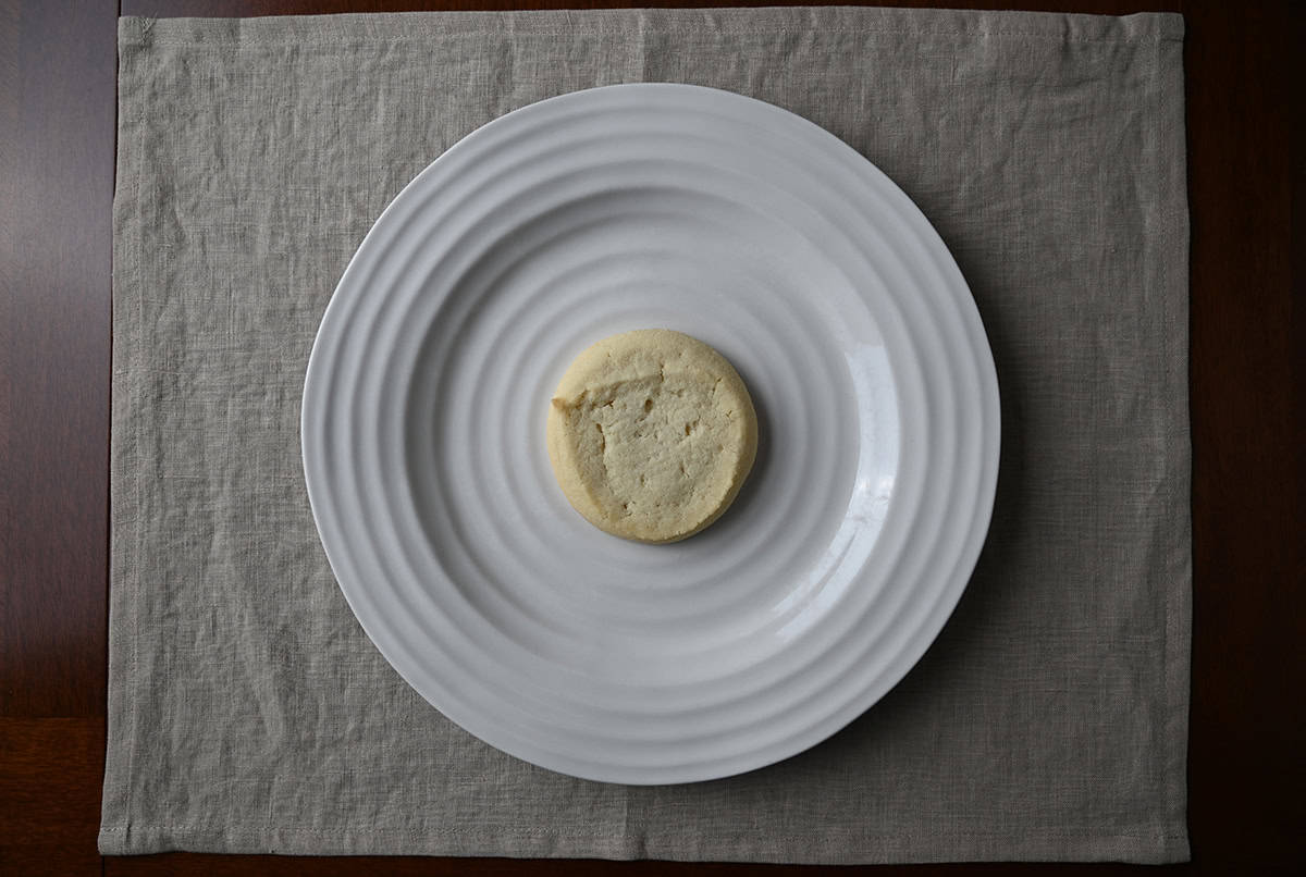 Image of one Costco Kirkland Signature Butter Shortbread Cookie sitting on a plate. 