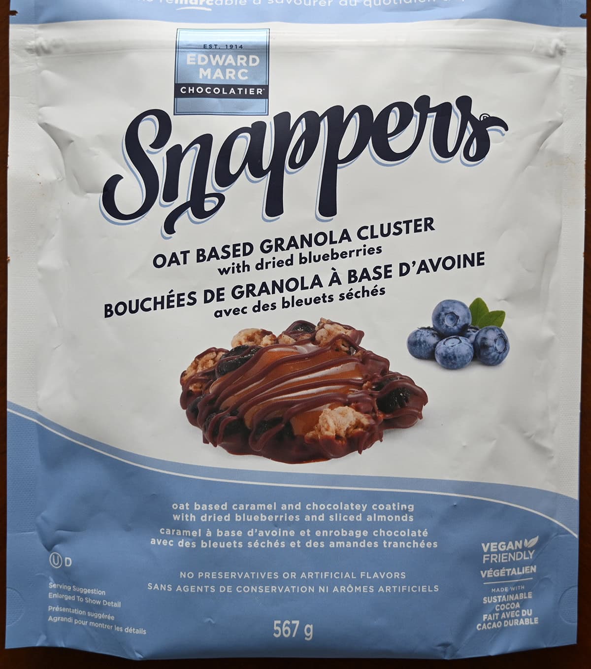 Closeup image of the front of the oat based granola clusters with dried blueberries Snappers bag.
