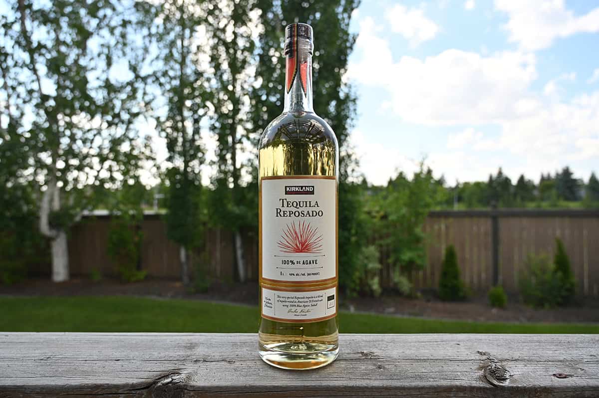 Image of the Resposado tequila bottle sitting on a deck unopened.