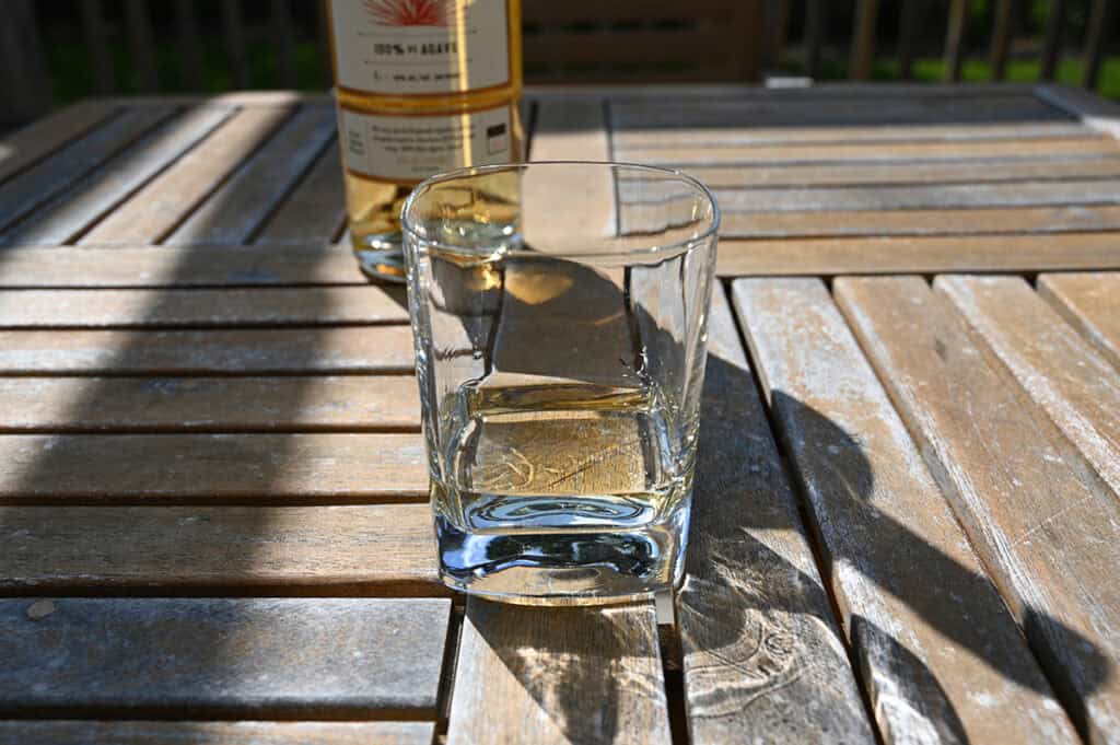 Image of a poured glass of Reposado tequila. 