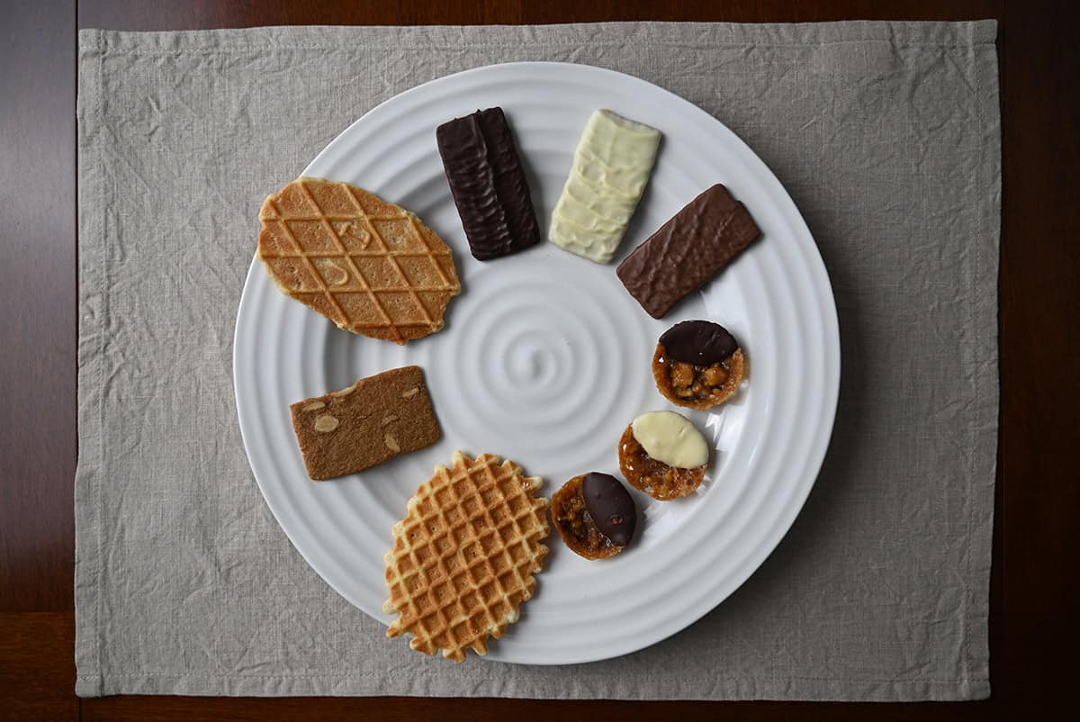 Image of the variety of cookies served on a white plate. 