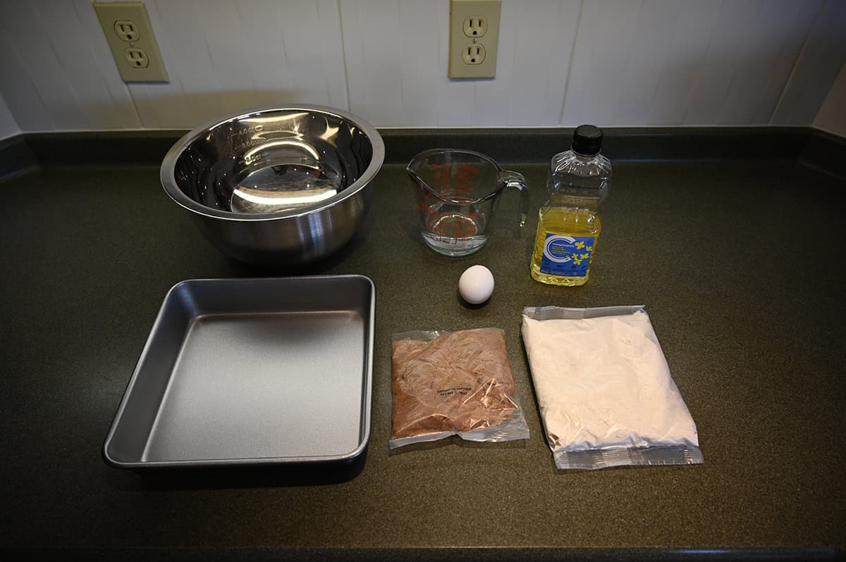 Top down image of all the ingredients needed to make the cinnamon swirl cake, like oil, eggs.