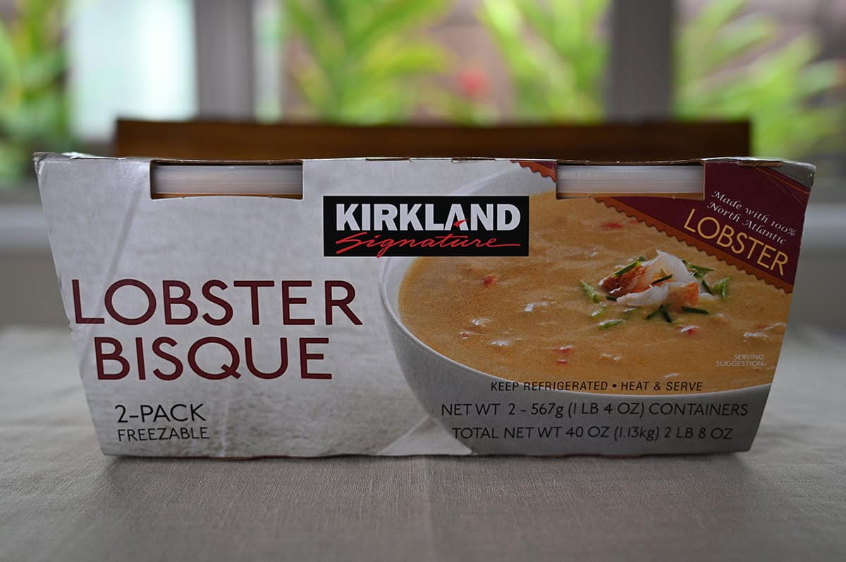 Image of the Costco Kirkland Signature Lobster Bisque two pack sitting on a table unopened.