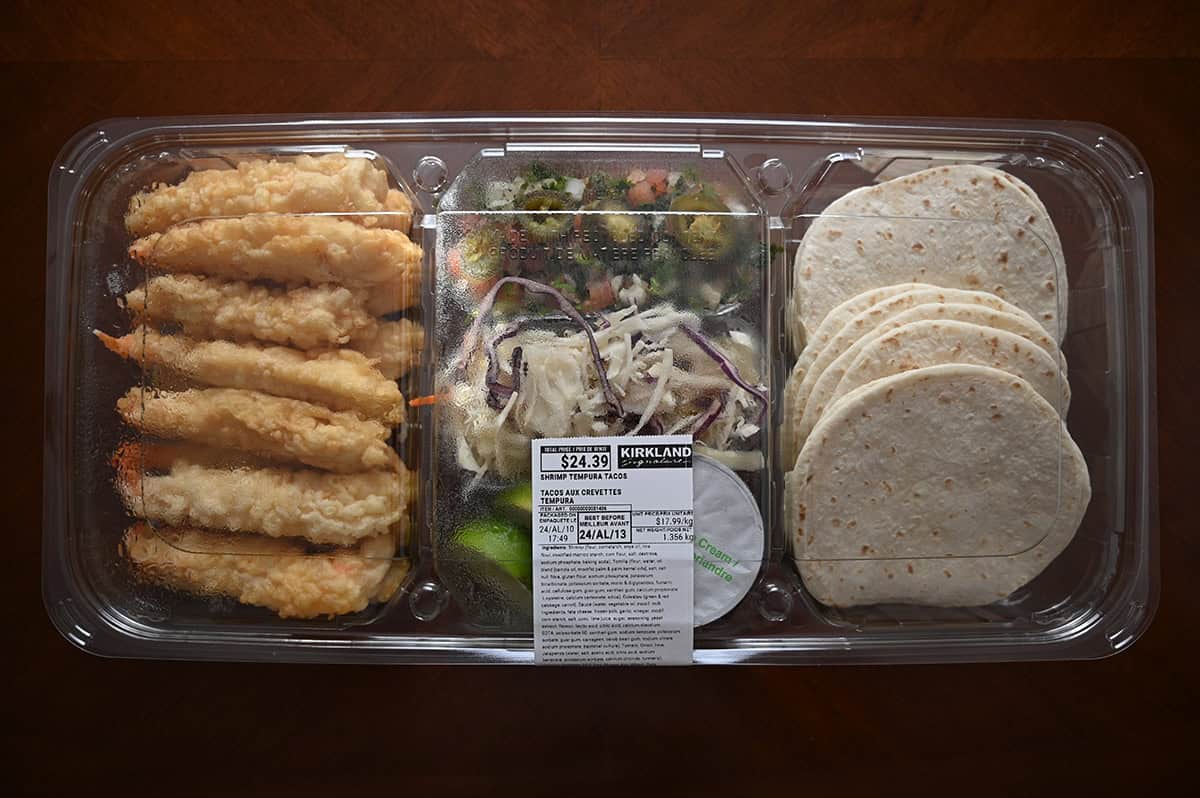 Image of the Costco Kirkland Signature Shrimp Tempura Tacos container sitting on a table unopened.