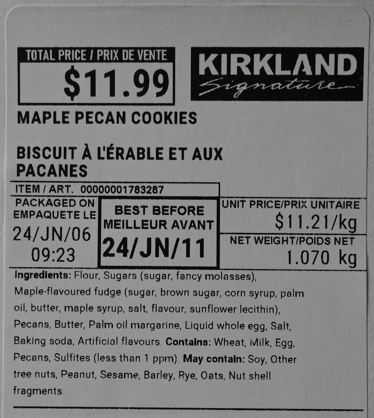 Closeup image of the front label on the Kirkland Signature Maple Pecan Cookies showing price, best before date and ingredients.