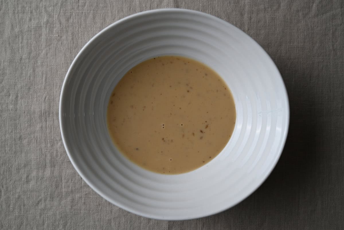 Top down image of a bowl of the dressing & marinade.
