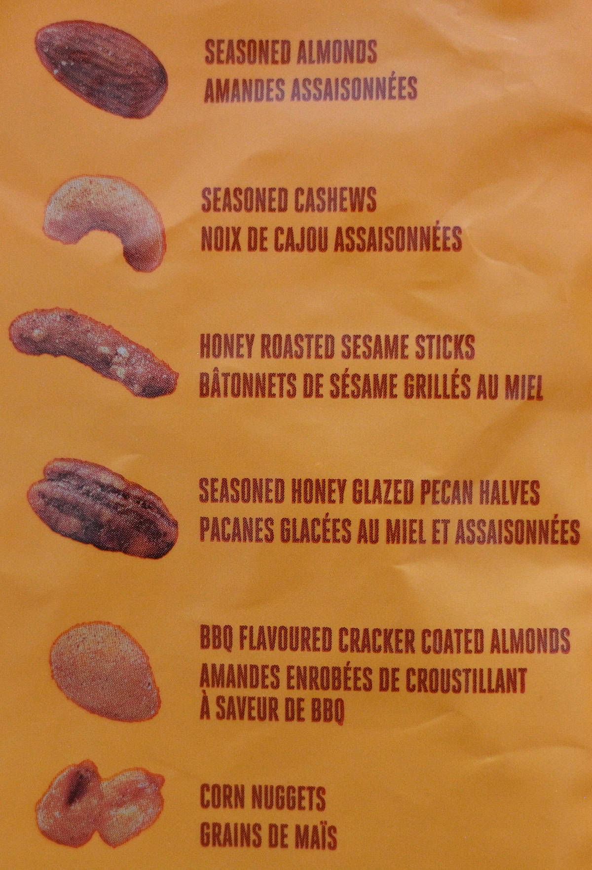 Image of the back of the bag of mix showing the different kinds of nuts,corn nuggets and pretzel sticks in the bag.