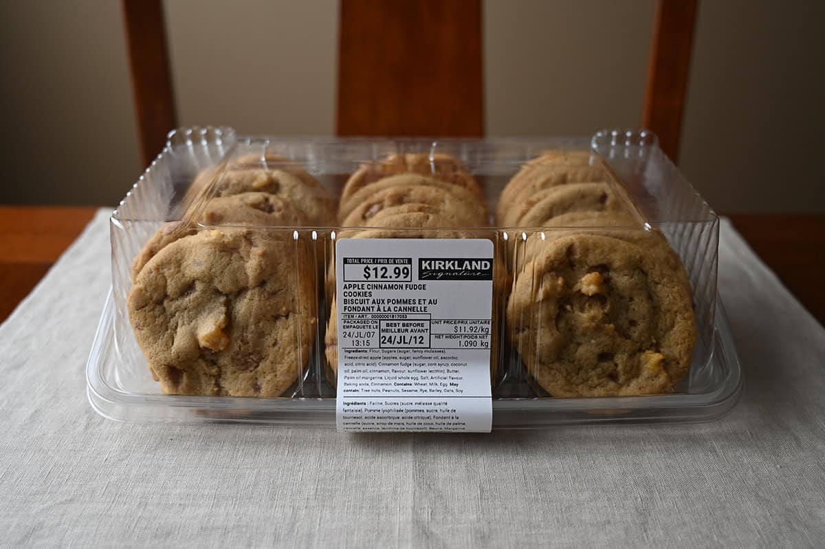 Image of the Costco Kirkland Signature Apple Cinnamon Fudge Cookies container sitting on a table unopened.