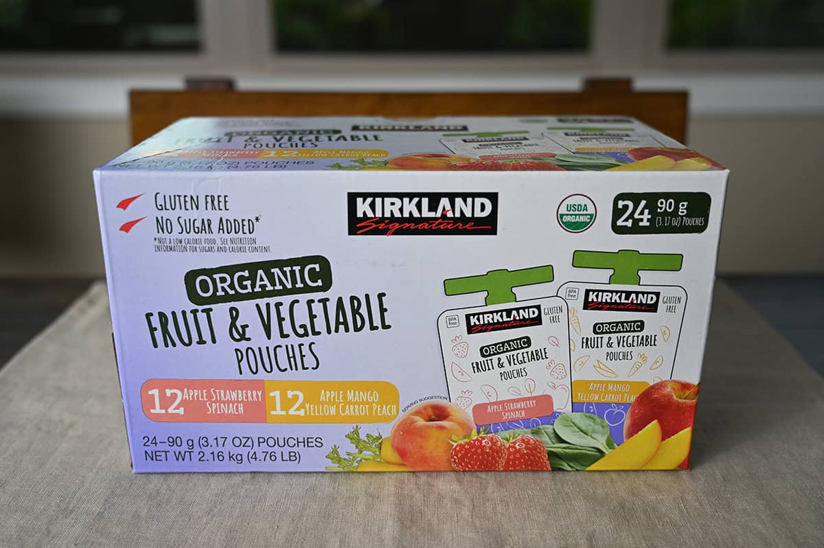 Image of the Costco Kirkland Signature Organic Fruit and Vegetable Pouches box sitting on a table unopened.