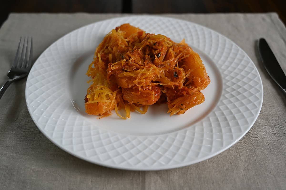 Sideview closeup image of a plate of spaghetti squash.