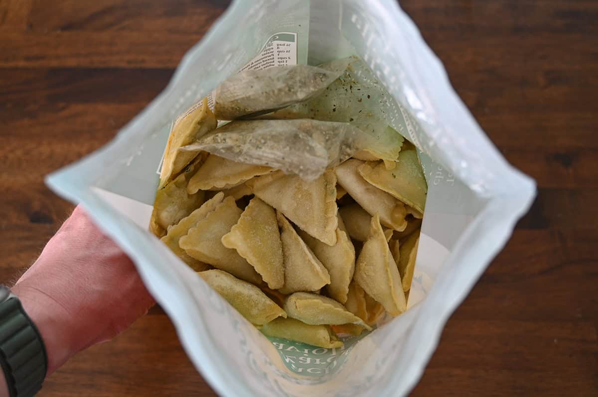 Image of the ravioli bag opened so you can see the frozen ravioli down in the bag. 