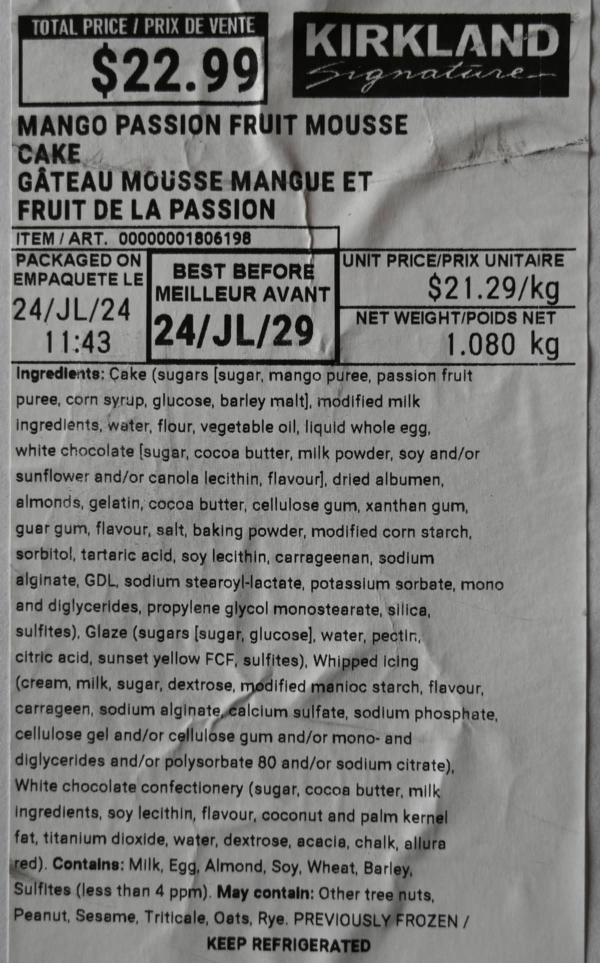 Closeup image of the label on cake showing cost, ingredients and expiry date.