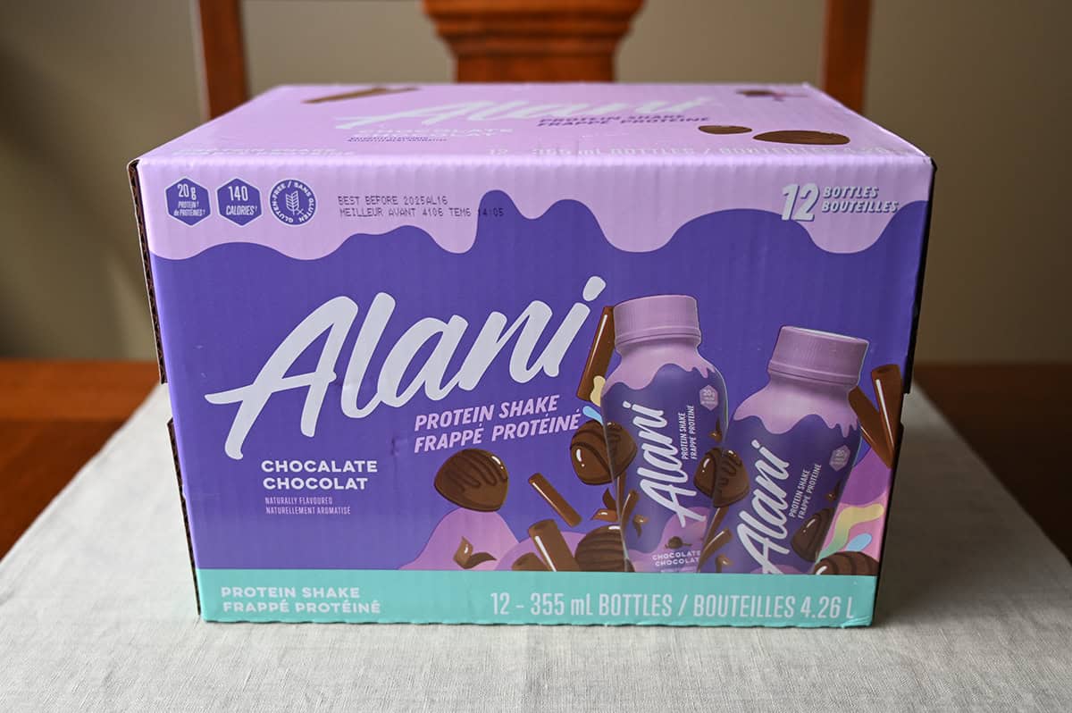 Image of the Costco Alani Protein Shake box sitting on a table unopened.