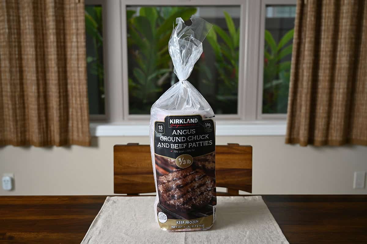 Image of a bag of Kirkland Signature Angus Ground Chuck and Beef Patties sitting on a table unopened.