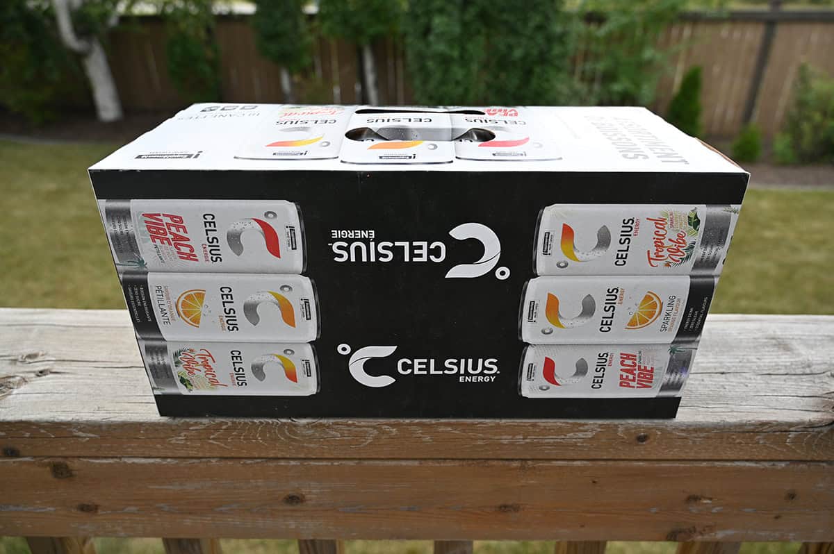 Image of the side of a case of Celsius sitting on a deck unopened.