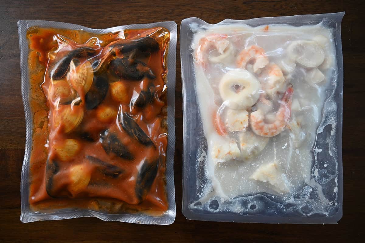 Top down image of the two vacuum sealed pouches of cioppino that come in the box.