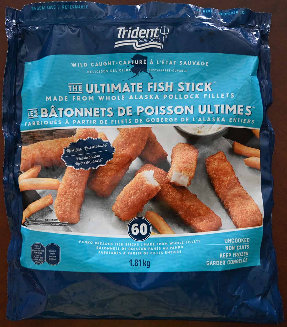 Closeup image of the front of the bag of fish sticks showing that there are 60 fish sticks and they're made from whole fillets.