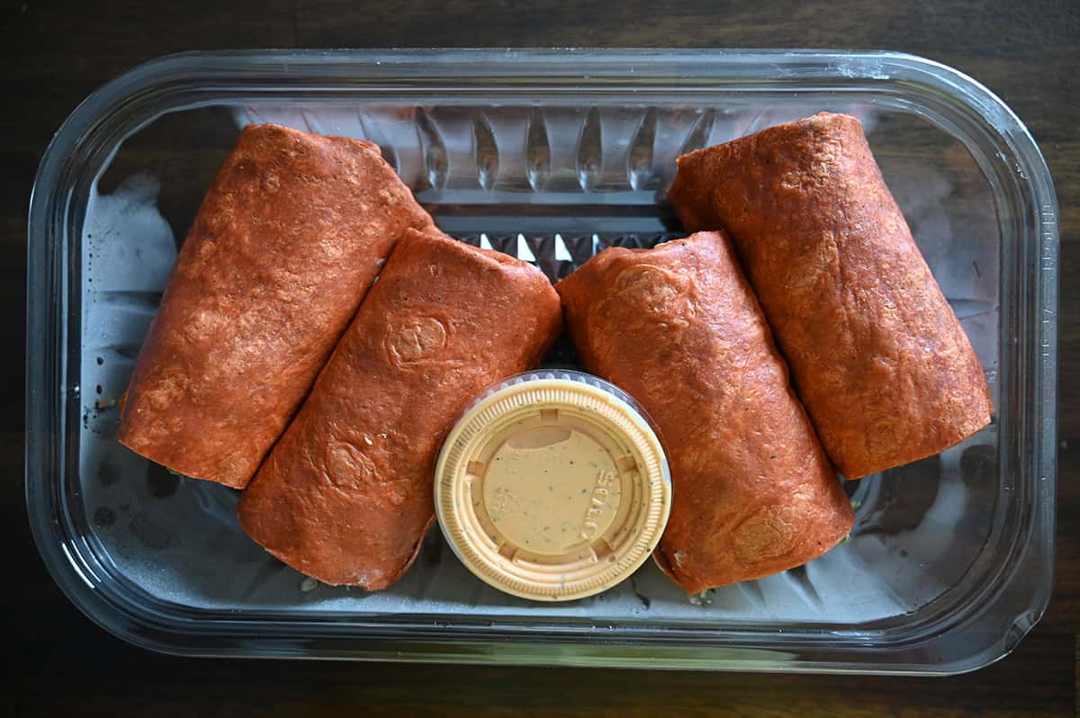 Top down image of the container of wraps opened and sitting on a table.