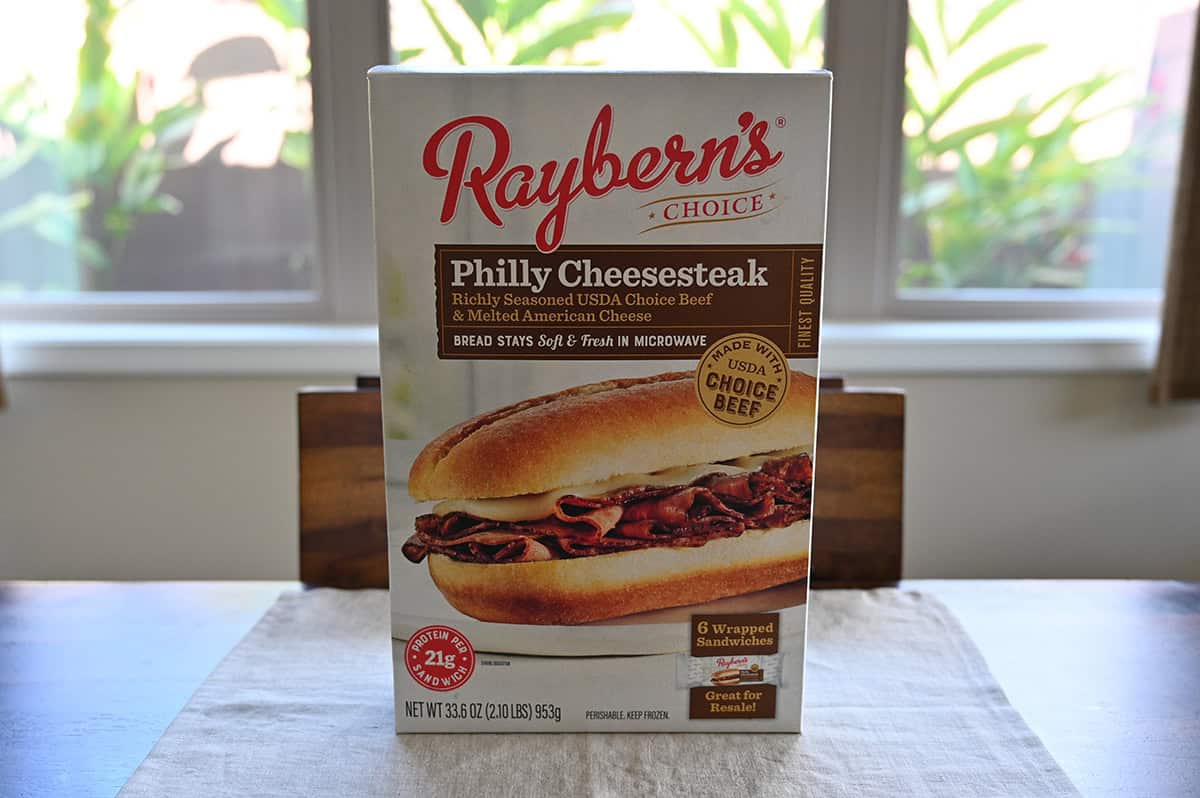 Image of the Raybern's Philly Cheesesteak sandwich box from Costco sitting on a table unopened.