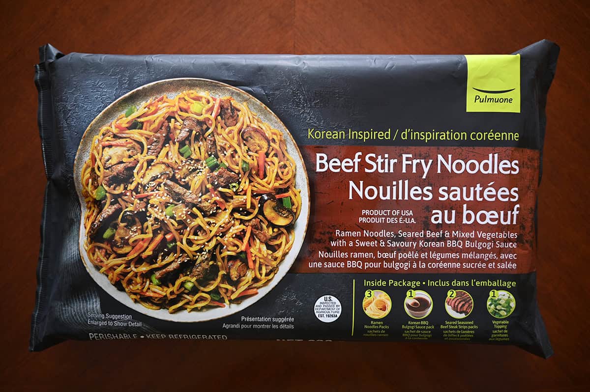 Image of the Pulmuone Beef Stir Fry Noodles Package unopened sitting on a table. 