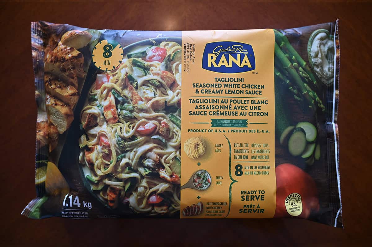 Image of the Costco Rana Tagliolini Seasoned White Chicken & Creamy Lemon Sauce package sitting on a table unopened.