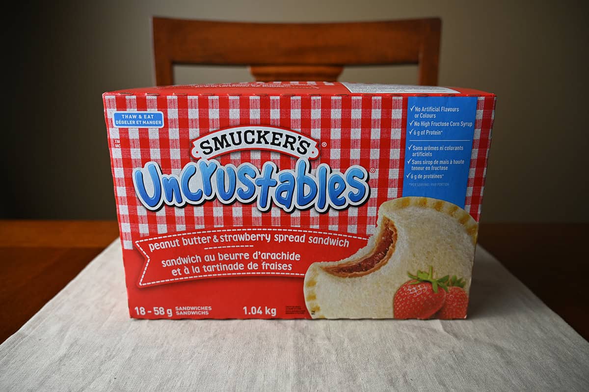 Image of the Costco Smucker's Uncrustables Box sitting on a table unopened.