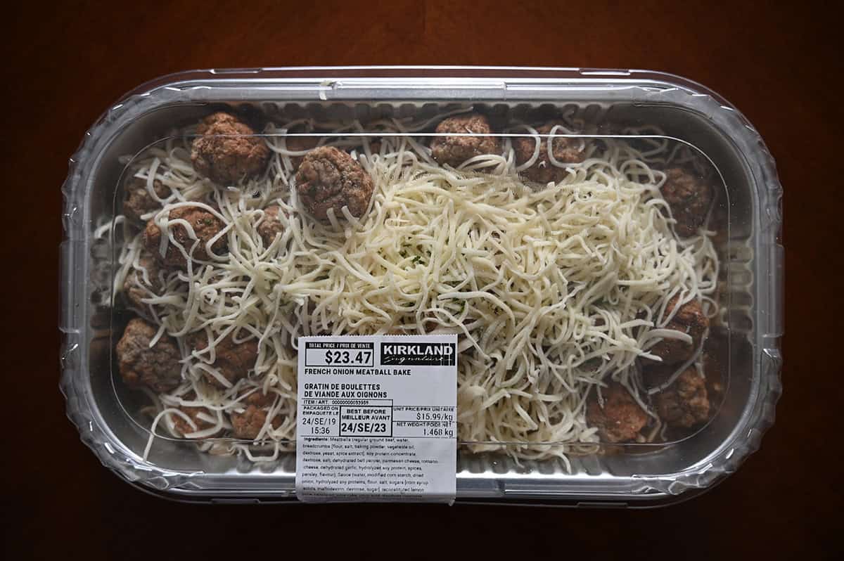 Top down image of the Costco Kirkland Signature French Onion Meatball Bake sitting on a table unopened.