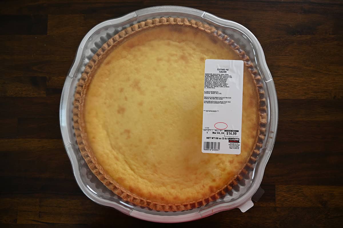 Image of a Costco Kirkland Signature Custard Pie unopened sitting on a table.