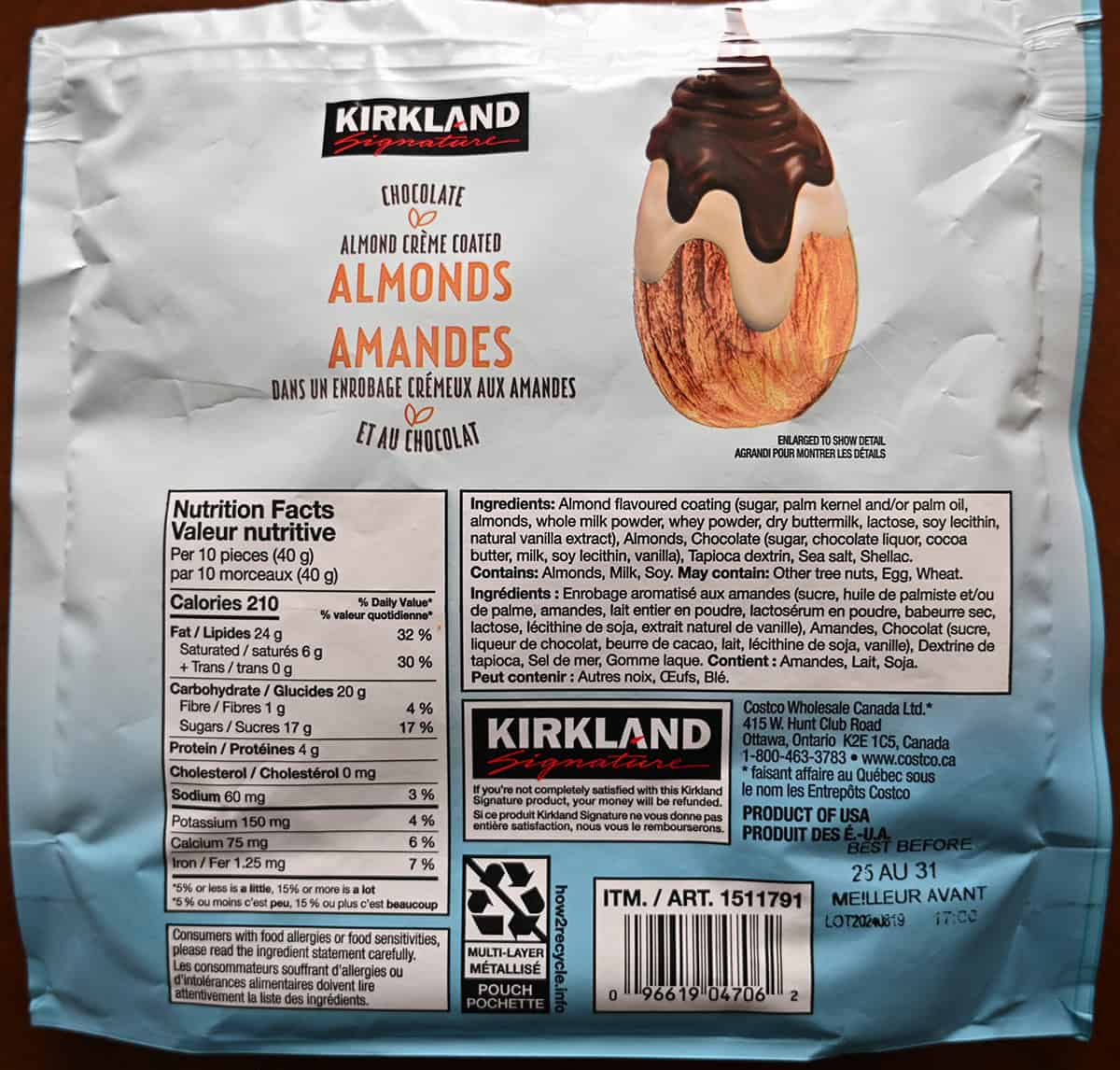 Image of the back of the Costco Kirkland Signature Chocolate Almond Creme Coated Almonds bag showing nutrition facts, ingredients and where they are made.