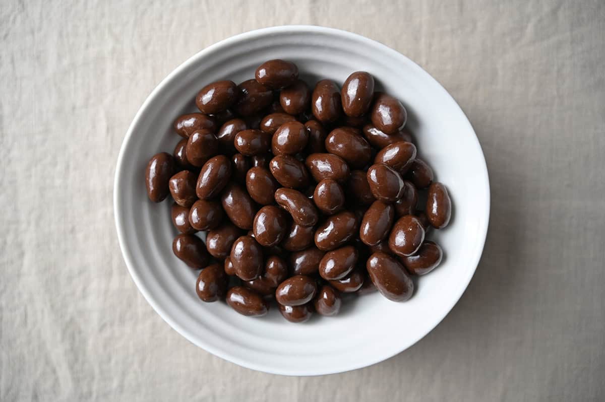 Image of a bowl of chocolate covered almonds. 