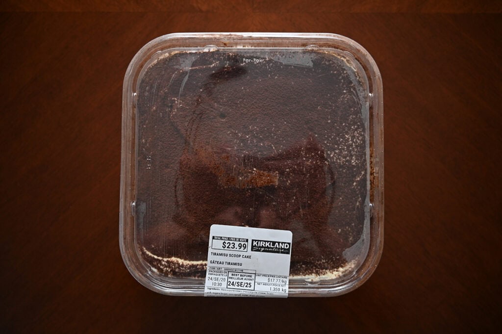 Image of the Costco Kirkland Signature Tiramisu Scoop Cake sitting on a table unopened.