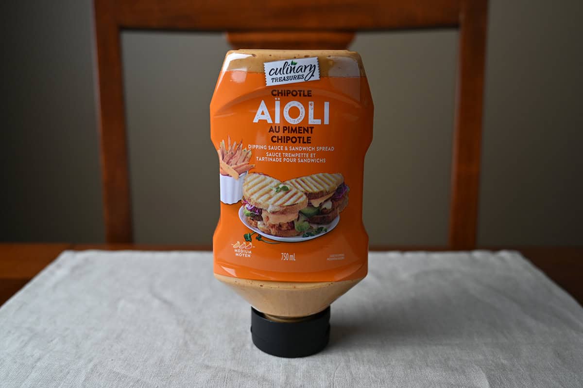 Image the Culinary Treasures Chipotle Aioli bottle sitting on a table unopened.