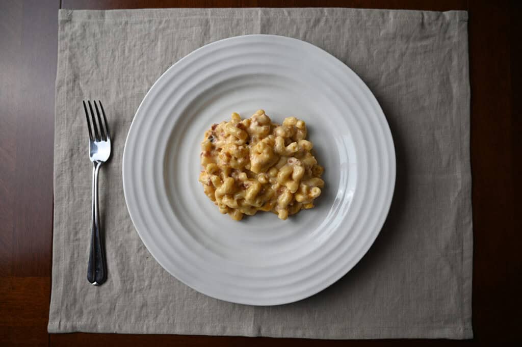 Image of a white plate with macaroni and cheese served on it.