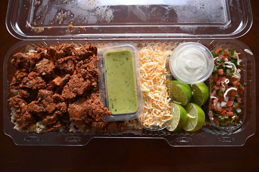 Top down image of the open container for the Costco Kirkland Signature Beef Birria Burrito Bowl.