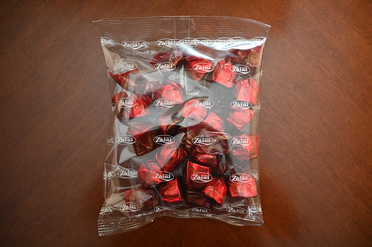 Image of a clear plastic bag with individually wrapped chocolates inside the bag.