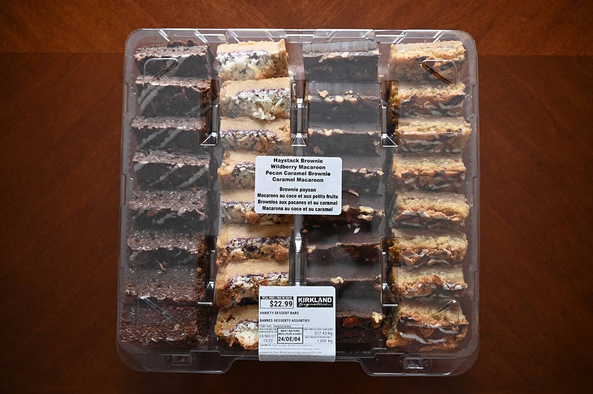 Image of the Costco Kirkland Signature Variety Dessert Bars container sitting on a table unopened.