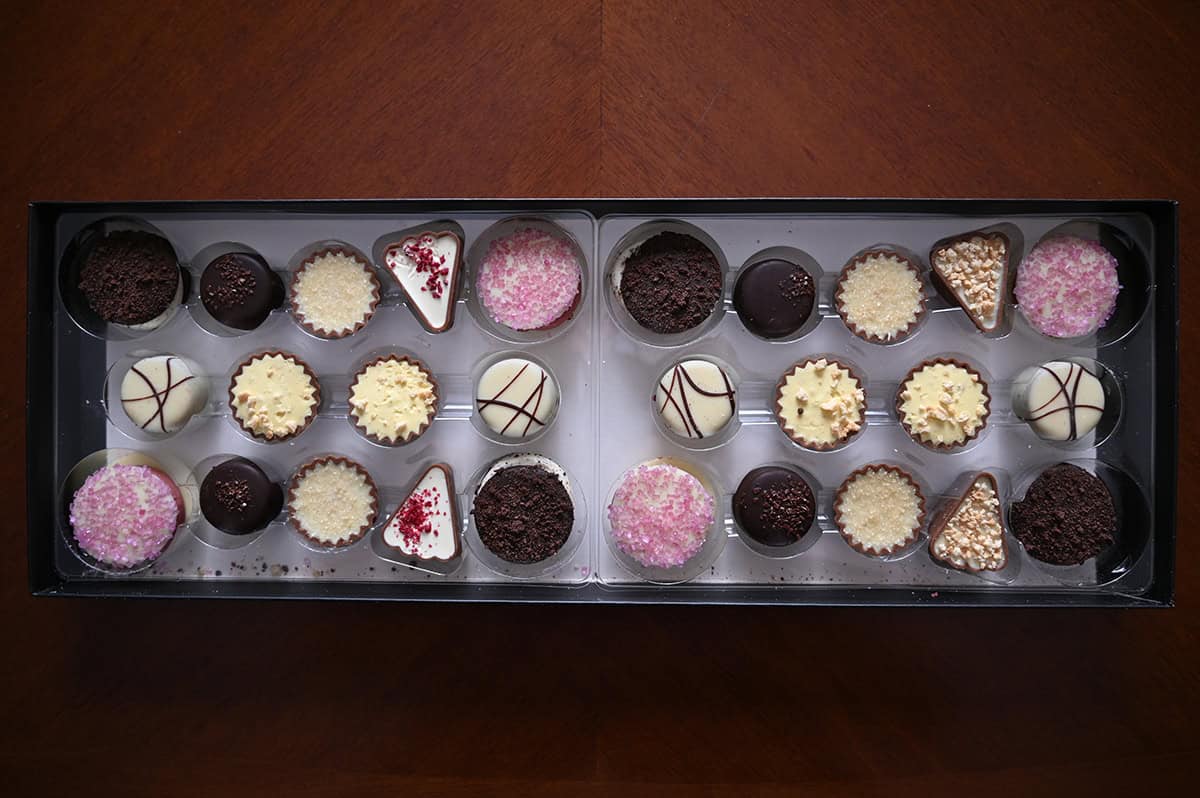 Top down image of an open box of Costco Chocodelice Desserts of Europe showing all the different flavors.