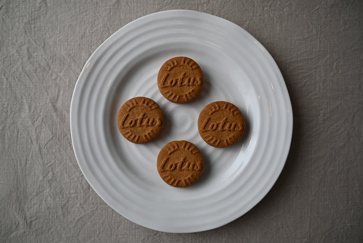 Top down image of four cookies served on a white plate.