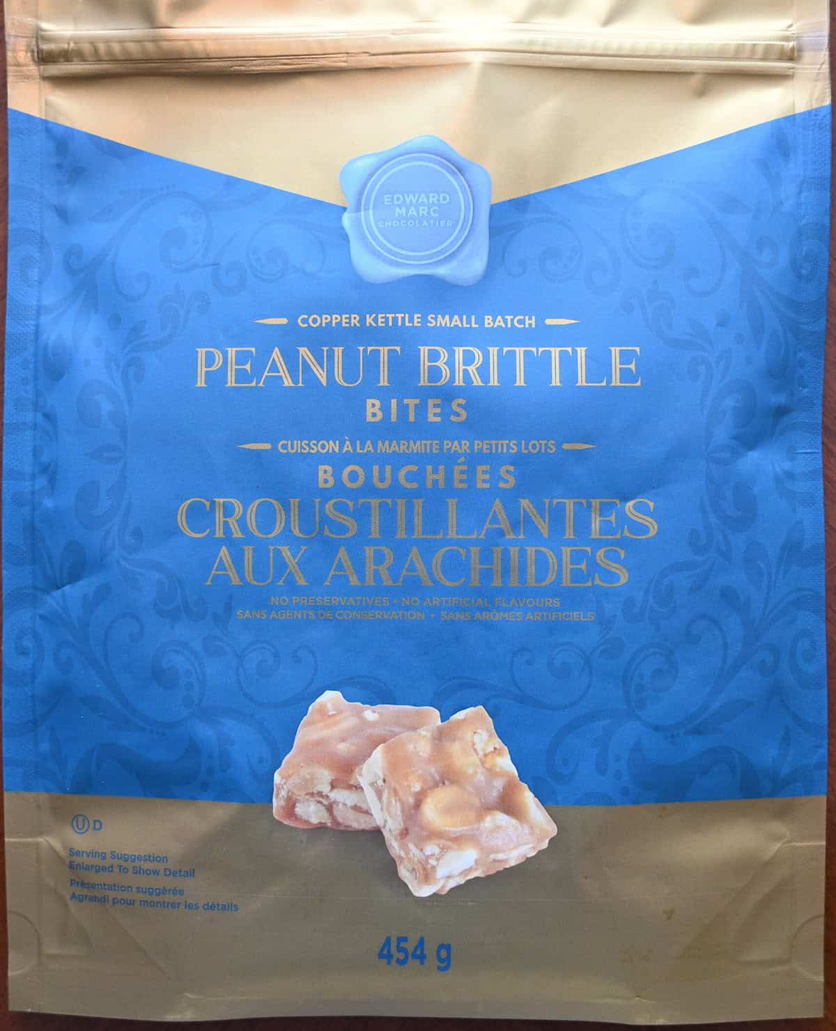 Closeup image of the bag of peanut brittle bites showing they're made in a copper kettle small batch.