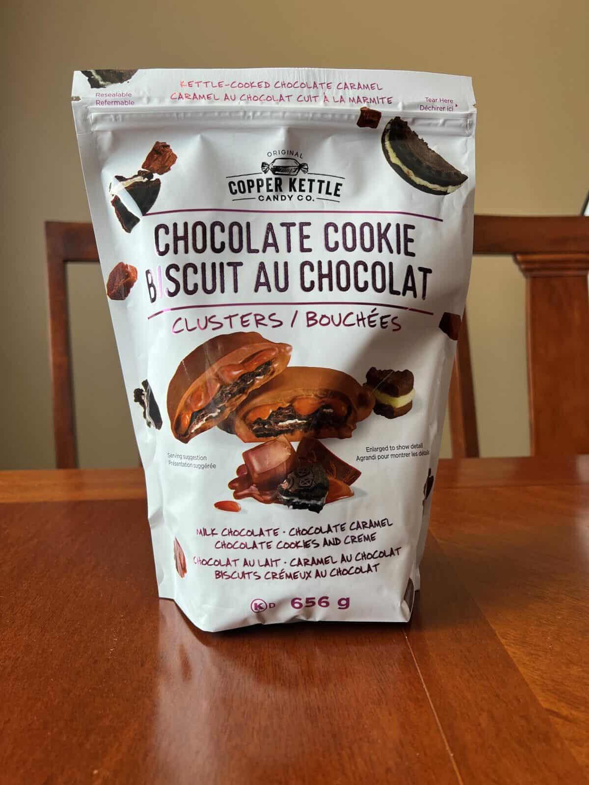 Image of the Costco Copper Kettle Candy Co. Chocolate Cookie Biscuit Clusters bag sitting on a table unopened.