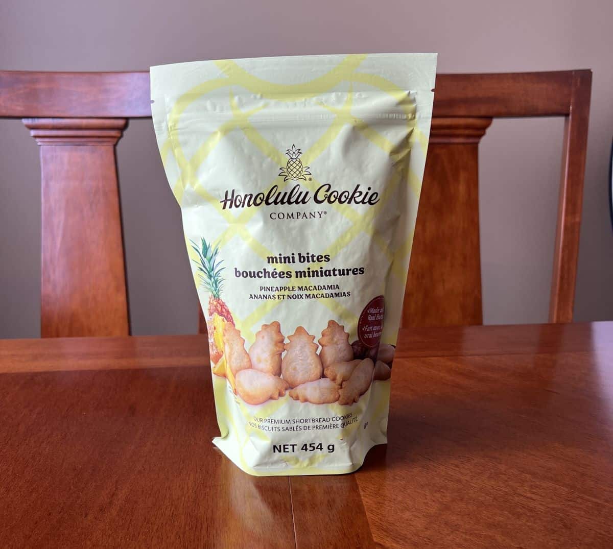 Image of the Costco Honolulu Cookie Company Mini Bites bag sitting on a table unopened. 