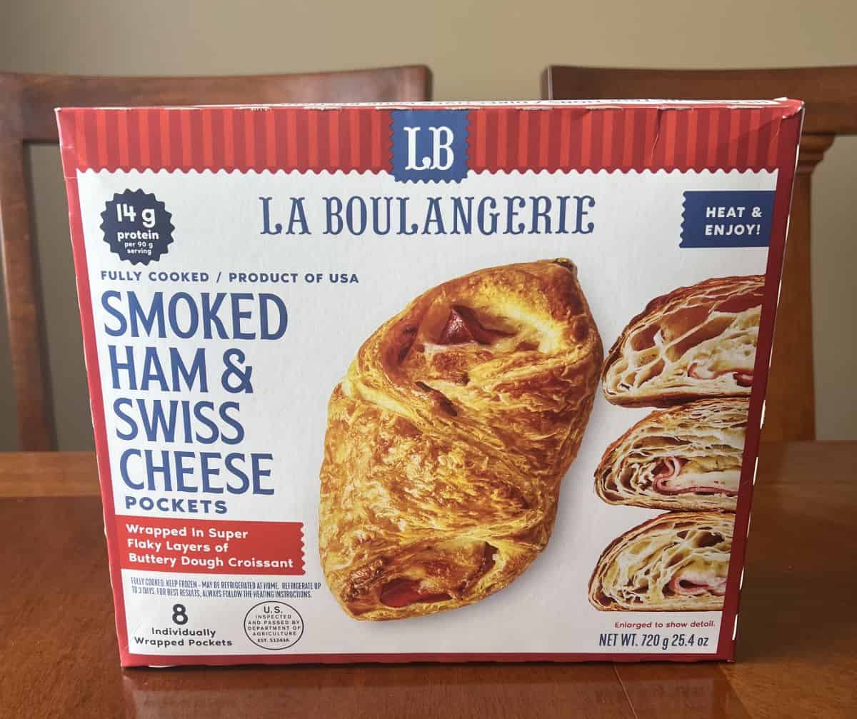 Image of the Costco La Boulangerie Smoked Ham & Swiss Cheese Pockets box sitting on a table unopened.