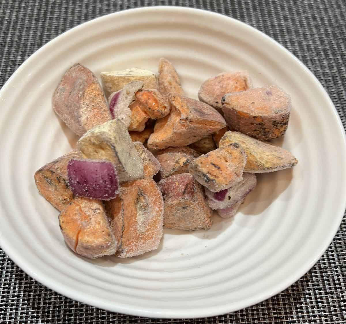 Image of a bowl of frozen root vegetables prior to heating them.