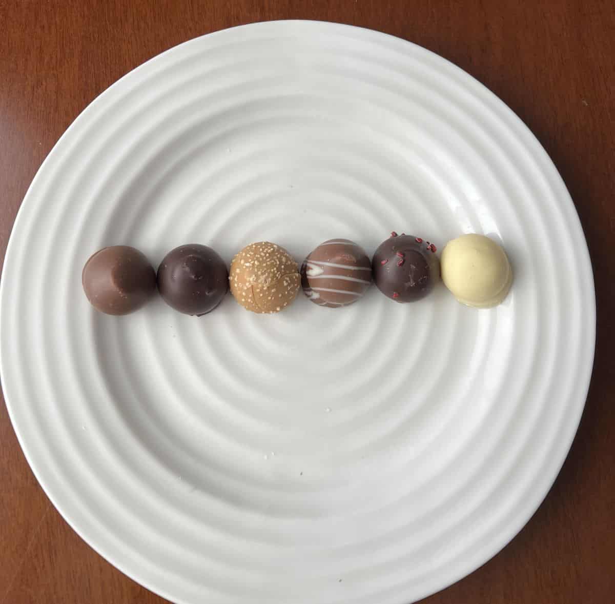 Image of all the chocolate covered marshmallows unwrapped sitting on a plate.