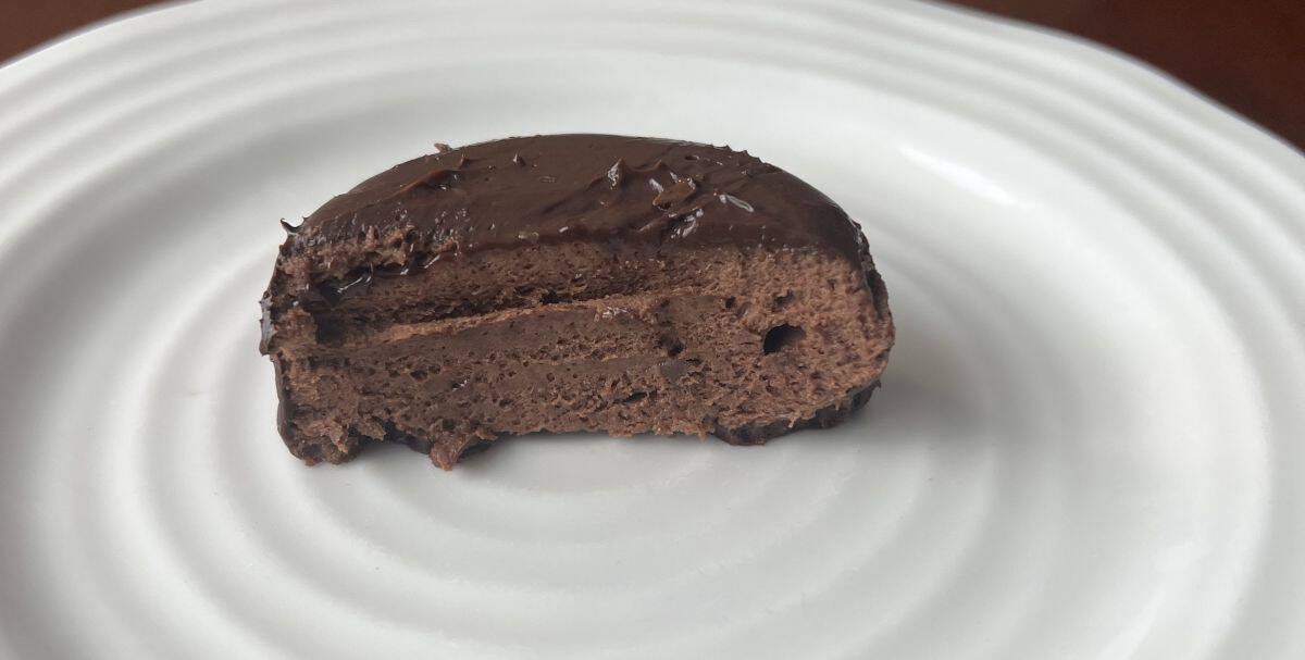 Closeup image of one Costco Kirkland Signature Chocolate Mousse Dessert cut in half so you can see what the inside of the dessert looks like.